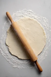 Roll out the chilled dough for the galette and fill with rhubarb