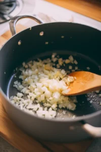 Sauté chopped onion and minced garlic until fragrant and translucent