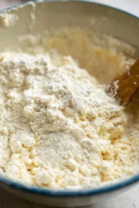 Scoop out small portions of dough, roll into balls, and place in air fryer basket