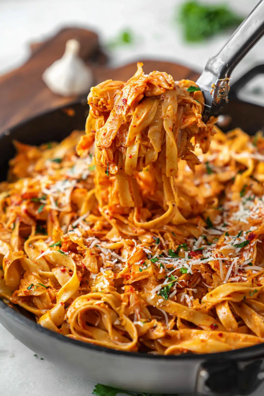 Serve the kimchi infused cabbage alfredo hot over your favorite pasta or spiralized vegetables garnished with additional parmesan if desired