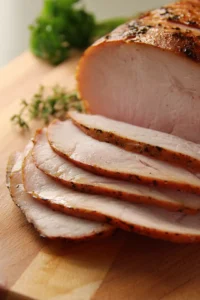 Slice turkey breast into thin strips and add to marinade