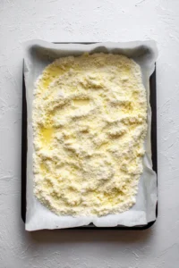 Spread the mixture evenly onto the prepared baking sheet