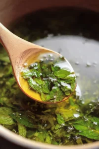 Stir gently to dissolve the honey and distribute the mint leaves and sea salt evenly.
