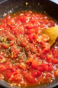 Stir in canned diced tomatoes and Italian seasoning and allow the mixture to simmer for 5 to 7 minutes until heated through
