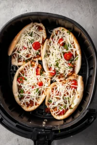 Stuff the pockets with cheese and your choice of toppings and cook them in the air fryer
