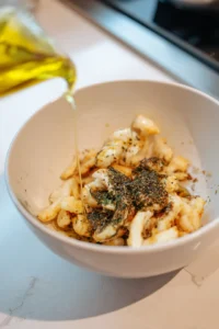 Toss halloumi fries with olive oil and za'atar seasoning