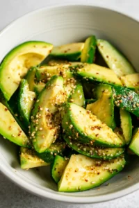 Toss sliced avocados with olive oil and everything bagel seasoning