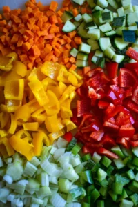 Toss vegetables and potatoes with olive oil and seasonings