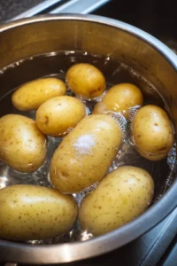 Wash the Jersey Royal potatoes and boil until tender