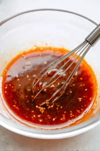 Whisk gochujang, soy sauce, maple syrup, and sesame oil together to create the sauce
