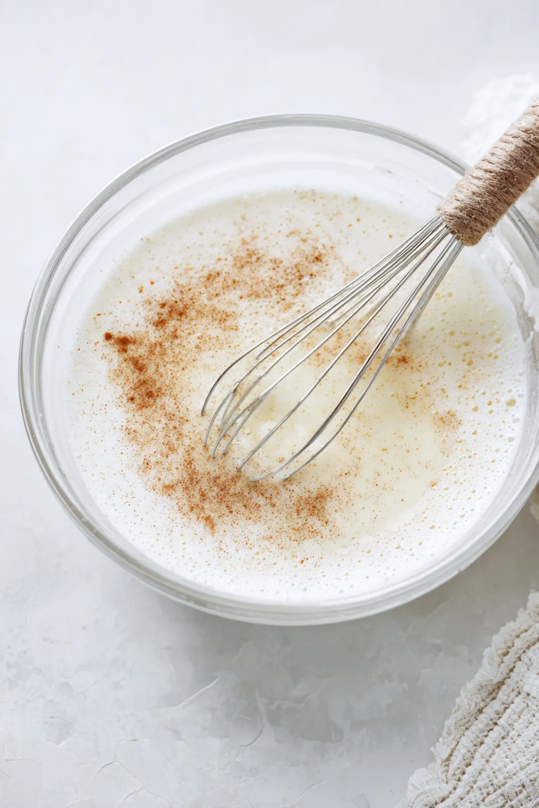 Whisk together the eggs, milk, sugar, vanilla extract, and cinnamon until fully combined