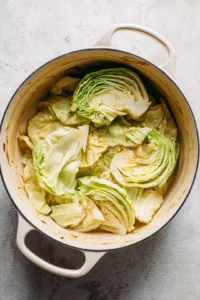 Add cabbage hearts to the pot and stir to coat in the miso-butter mixture
