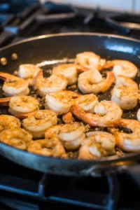 Add shrimp to pan and cook until pink