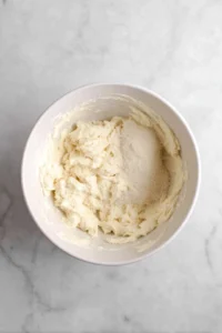 Beat together cream cheese and sugar until smooth