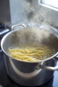 Boil water and cook linguine until al dente