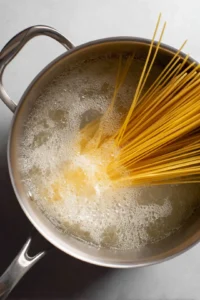 Bring a large pot of salted water to a boil and cook pasta until al dente