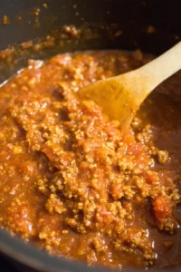 Brown the lean ground beef in the pot