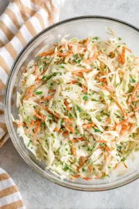 Chill the coleslaw in the refrigerator for at least 30 minutes before serving to let the flavors meld together.