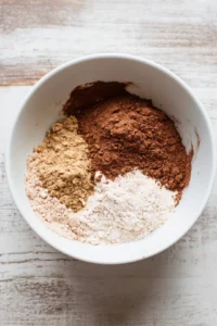 Combine cassava flour, cocoa powder, and sweetener in a large mixing bowl