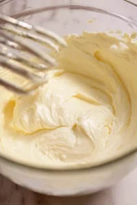 Combine cream cheese, sugar, and vanilla, then add eggs and pour over crust