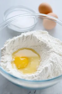 Combine flour, sugar, and salt with milk mixture