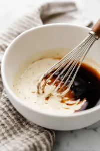 Combine heavy cream, soy sauce, and parmesan cheese to make a creamy sauce base