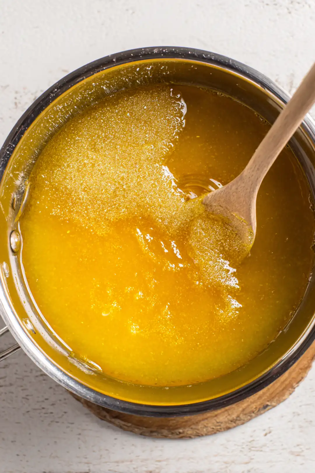 Combine juice and sweetener in a saucepan over medium heat