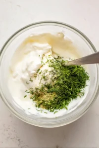 Combine kefir, sour cream, lemon juice, garlic powder, onion powder, fresh dill, and salt in a medium mixing bowl
