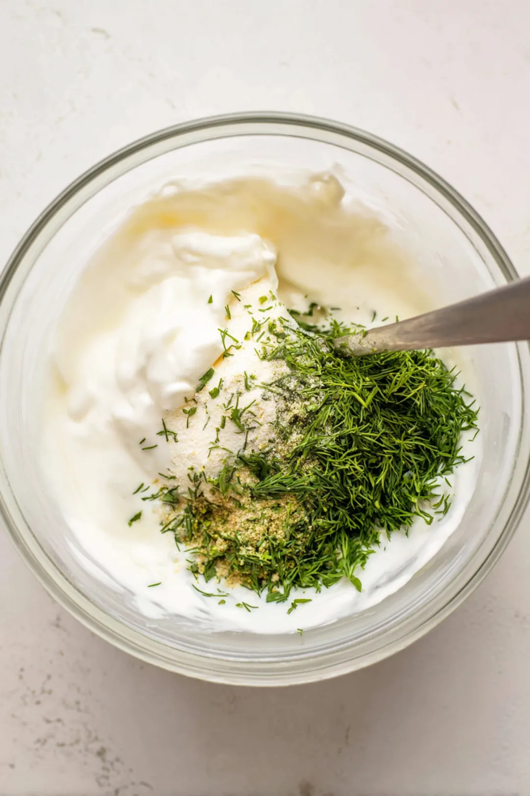 Combine kefir, sour cream, lemon juice, garlic powder, onion powder, fresh dill, and salt in a medium mixing bowl