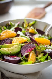 Combine roasted beets, orange segments, and avocado slices in a large bowl