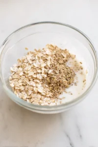 Combine rolled oats, almond milk, ground flaxseeds, and honey