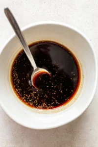 Combine soy sauce, mirin, sake, and sugar to create the yakitori marinade