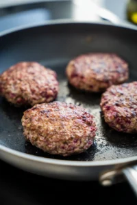 Cook ground beef until browned and form into patties