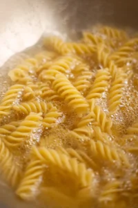 Cook high-protein pasta according to package instructions