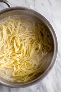 Cook the fettuccine until al dente