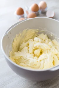 Cream together the butter, granulated sugar, and brown sugar until light and fluffy