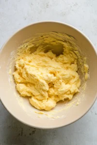 Cream together the softened butter and granulated sugar