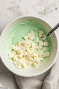 Dip truffles into melted white chocolate