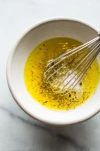 Drizzle olive oil and lemon juice over the salad