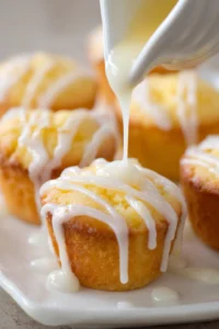 Drizzle the glaze over the cooled muffins before serving