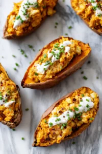 Fill sweet potato halves with cheese mixture and top with sour cream