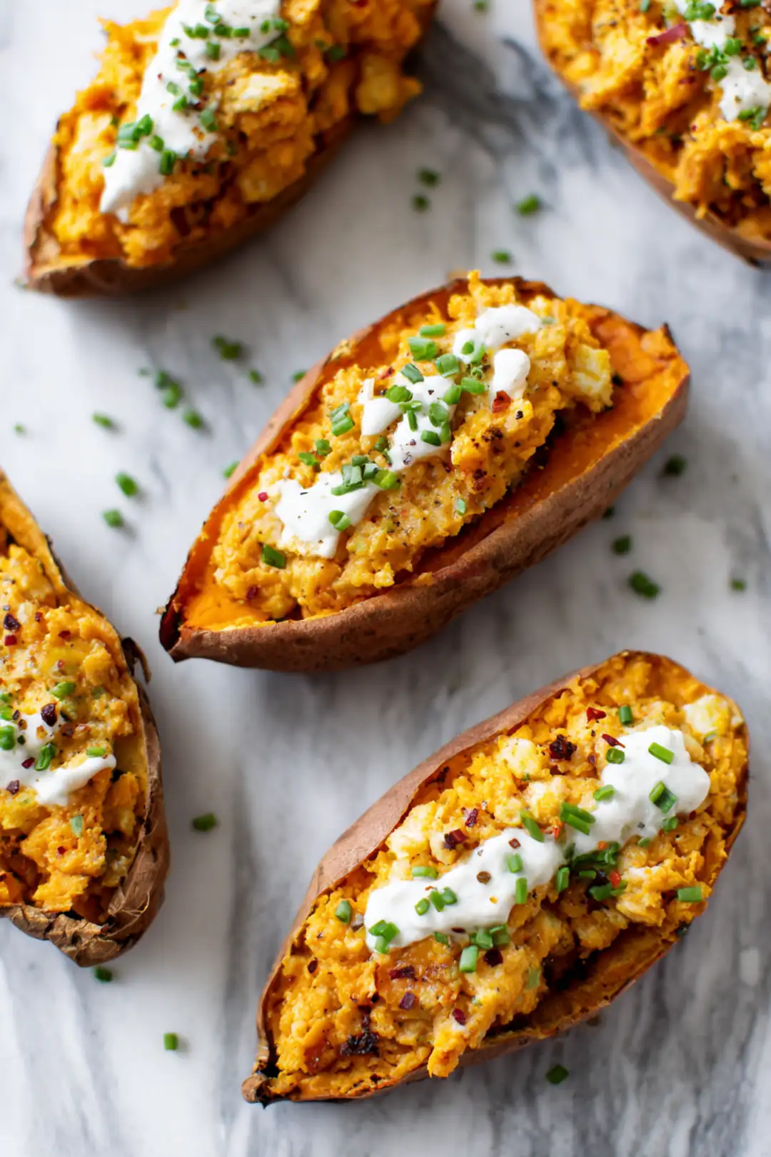 Fill sweet potato halves with cheese mixture and top with sour cream