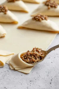 Fill the crescent roll dough with pecan mixture and roll up
