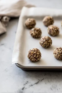 Form mixture into small balls and place them on a baking sheet