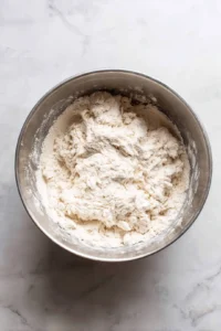 Knead dough until smooth and elastic, then let rise for 1 hour