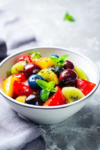 Let the fruit salad rest for about 10 minutes to allow the flavors to meld