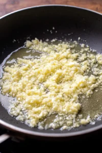 Melt the butter and sauté minced garlic until fragrant