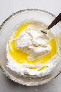 Mix Greek yogurt, honey, lemon juice, salt, and pepper