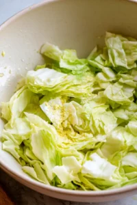 Place cabbage pieces in air fryer for cooking