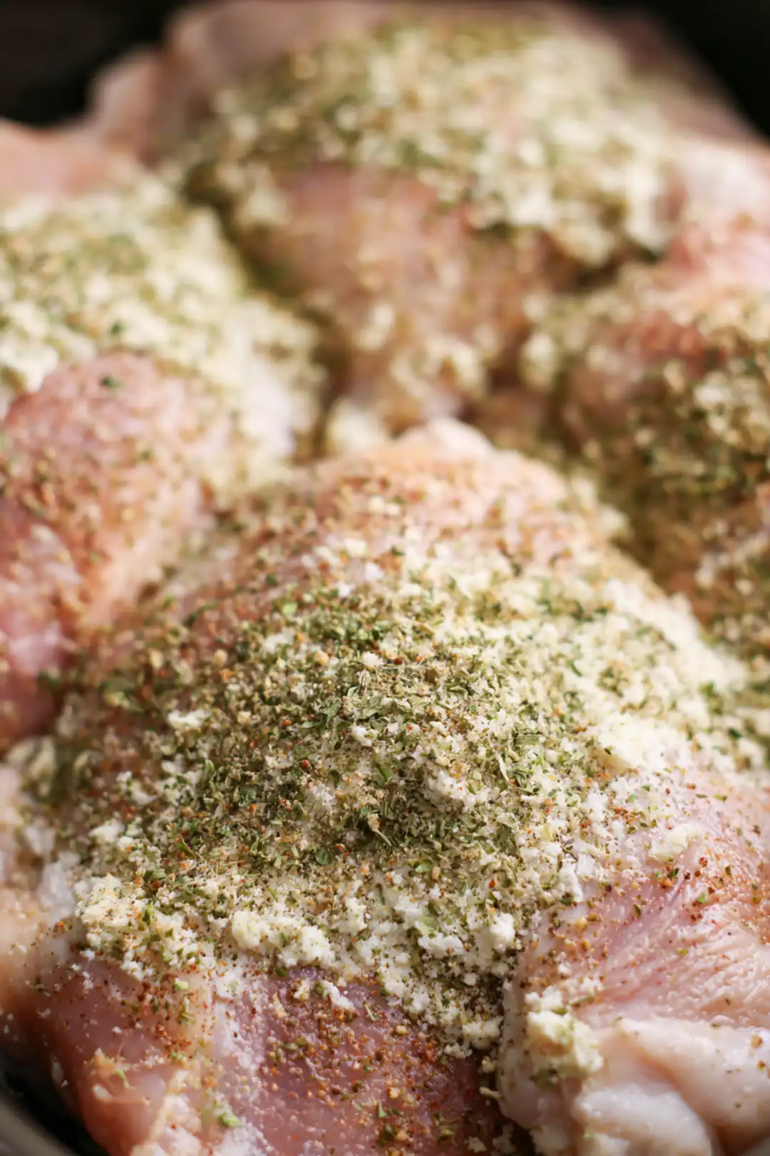 Place the boneless chicken thighs in the slow cooker and sprinkle the ranch dressing mix evenly over the top.